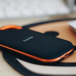 orange and black jbl portable speaker